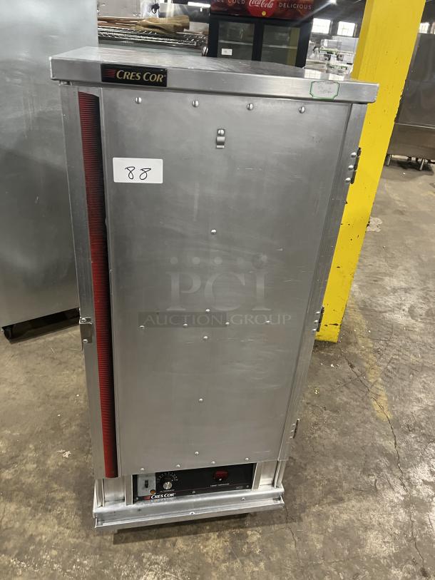 Cres Cor stainless steel heated holding/proofing cabinet, model 1290006, with built-in pan slides and caster wheels.