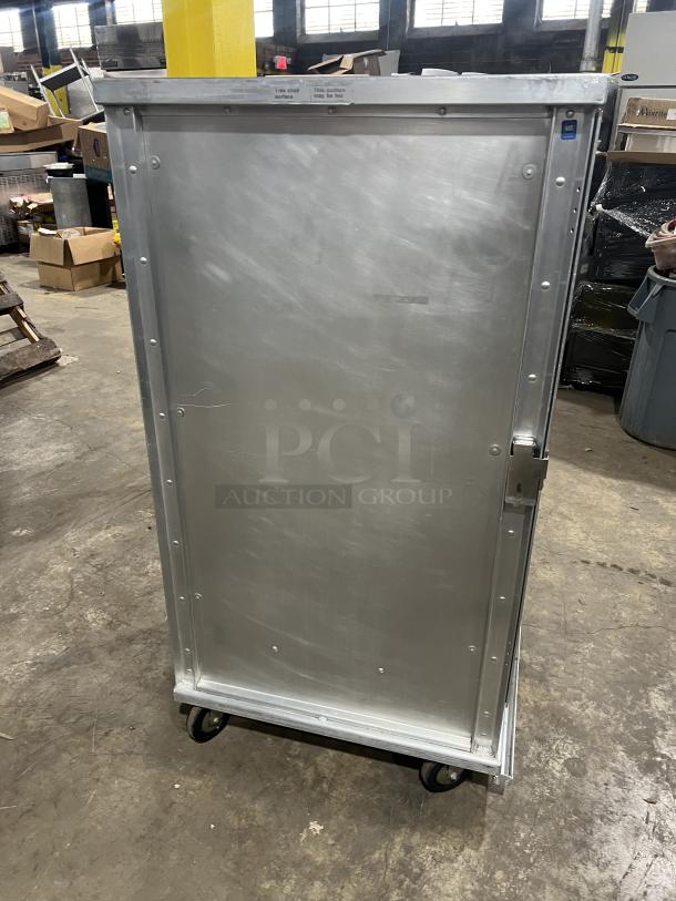 Cres Cor stainless steel heated cabinet, model 1290006, on casters, condition good, 120V, with built-in pan slides.