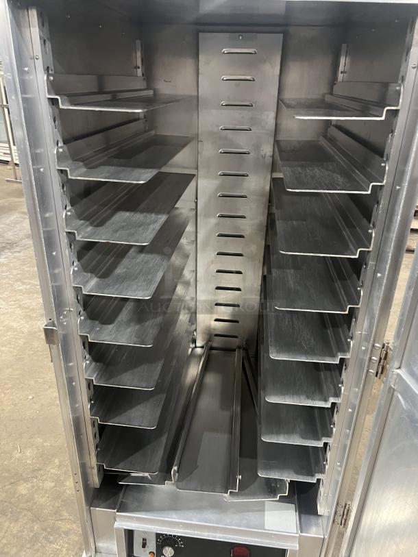 Cres Cor Model 1290006 stainless steel heated holding/proofing cabinet with built-in pan slides, on casters. 120V, 1 Phase.