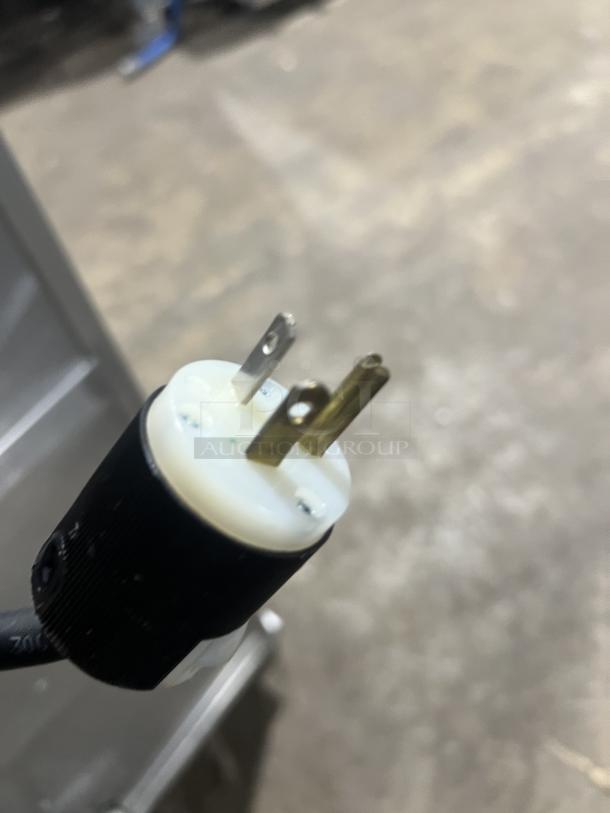 Close-up of an electric plug for the Cres Cor stainless steel heated holding cabinet, model 1290006, 120V, 1 Phase.