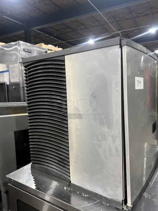 Manitowoc stainless steel ice maker, model IY0906A-261. Electric, air-cooled, good condition, visible tags.