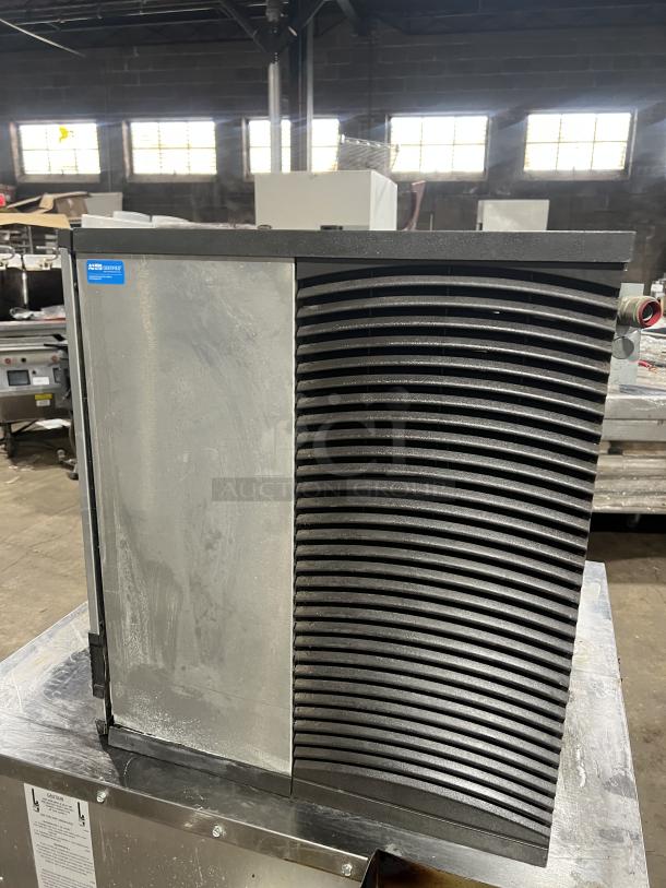 Manitowoc IY0906A-261 commercial ice machine, stainless steel, air-cooled, half dice cube style, 208-230V, 1 phase.