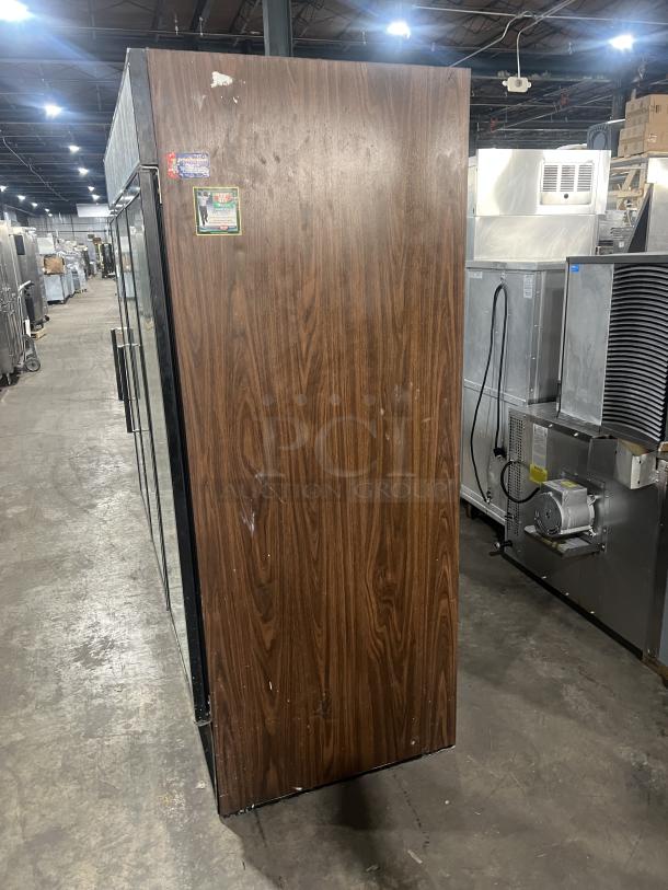 Beverage Air MT72 commercial fridge, 3 glass doors, poly-coated wire racks, serial 2615804, 115V, 1 phase, wood-grain finish.