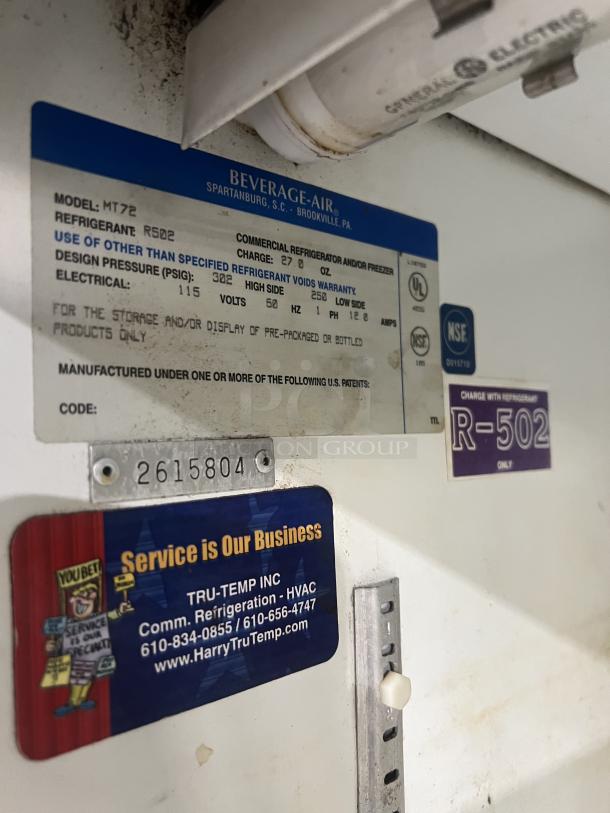 Beverage Air MT72 commercial refrigerator label showing model, serial number 2615804, and service contact information.