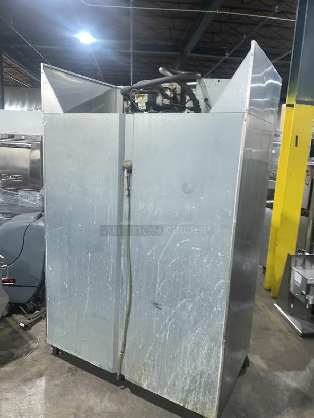 Continental 2R stainless steel 2-door reach-in refrigerator, model 2R, on casters, with signs of wear, 115V 1 Phase.