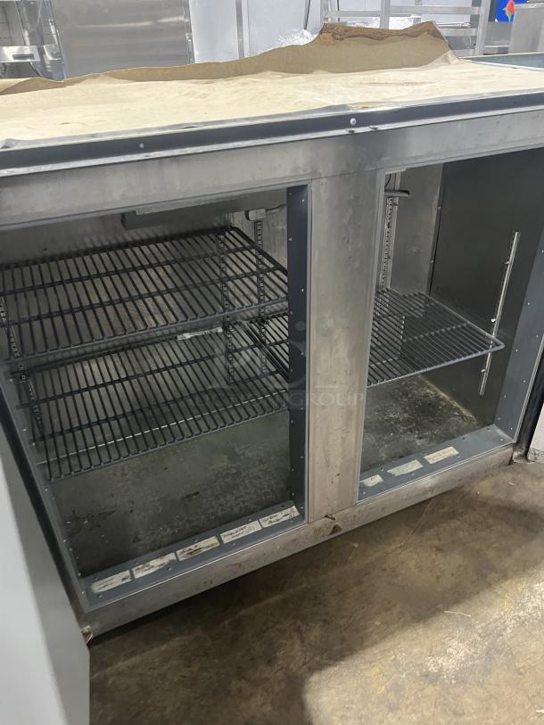 Perlick C5064ESCUL 3-door bar back cooler, stainless steel, wired rack, model visible. Good condition.