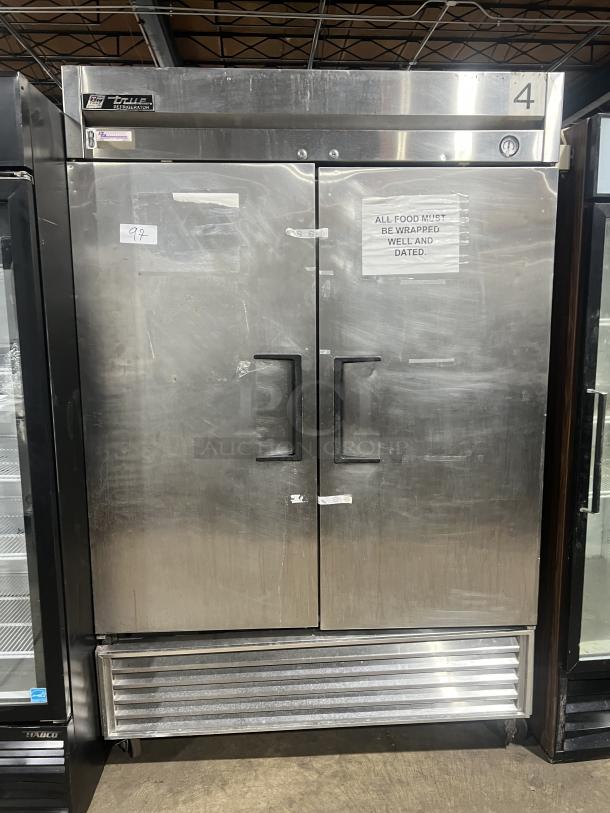 True T-49 commercial stainless steel 2-door reach-in refrigerator on casters. Model T-49, SN 6526031, 115V 1 Phase. Visible condition: used.