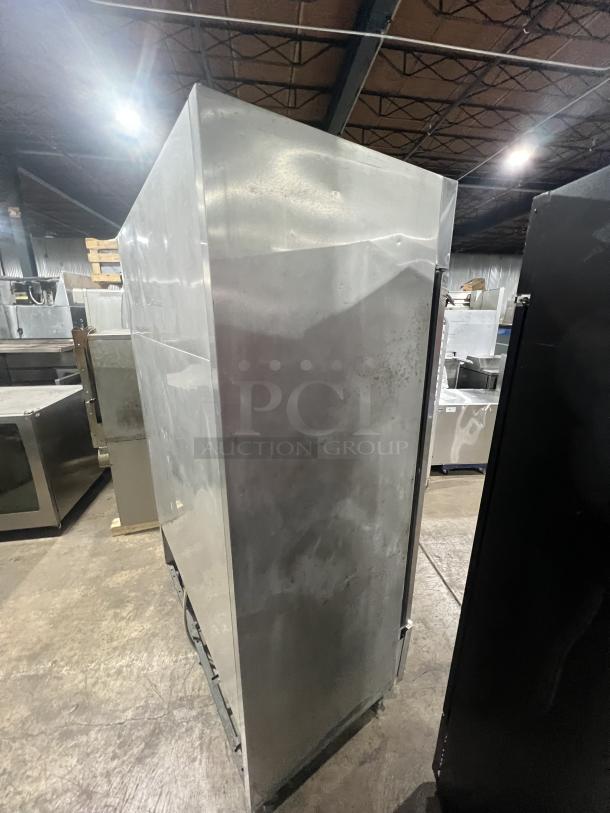 True T-49 commercial stainless steel 2-door reach-in refrigerator, on casters, 115V 1 Phase. Serial No: 6526031. Visible side detail.