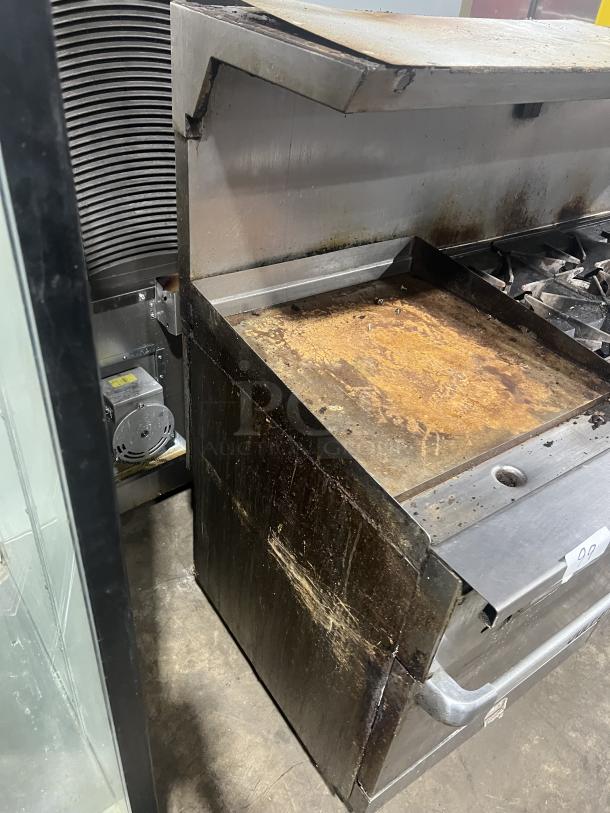 Vulcan 72SS-2-24G8B stainless steel 8-burner range with split top griddle, double oven, backsplash, salamander shelf; well-used condition.