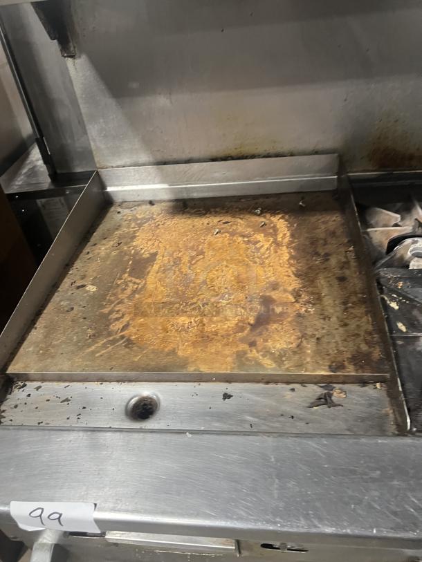 Vulcan 72SS-2-24G8B stainless steel 8-burner range with flat griddle, double oven, backsplash, and salamander shelf. Signs of wear.