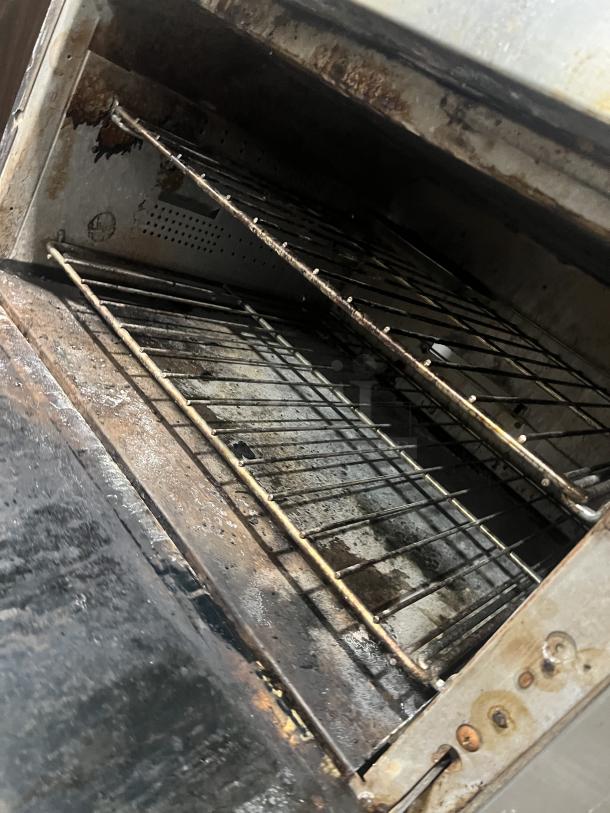 Vulcan 72SS-2-24G8B commercial range oven interior showing dual racks, natural gas powered, stainless steel, used condition.