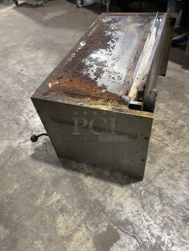 Commercial stainless steel gas salamander broiler with visible rust and wear, suitable for kitchen use.