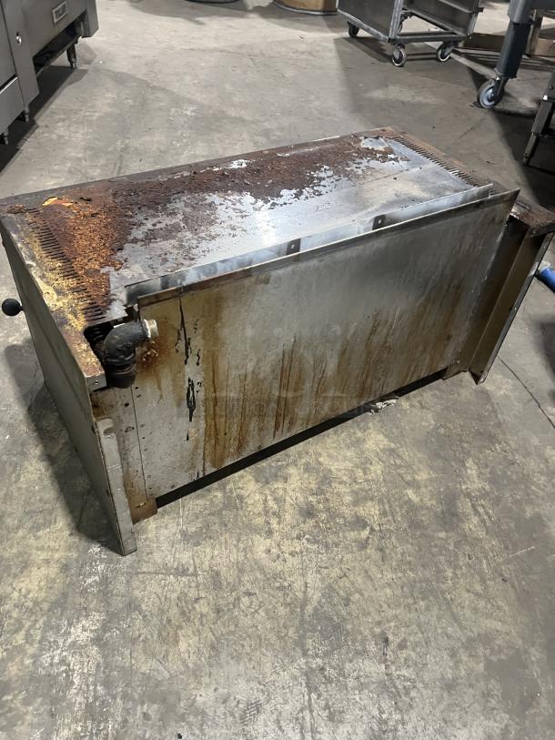 Commercial stainless steel gas salamander broiler, used, significant rust and wear on surface, suitable for parts or restoration.