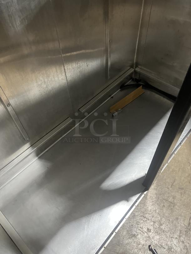 True Commercial Stainless Steel 2-Door Reach-In Refrigerator, Model TR2RRI2S, interior view, clean condition.