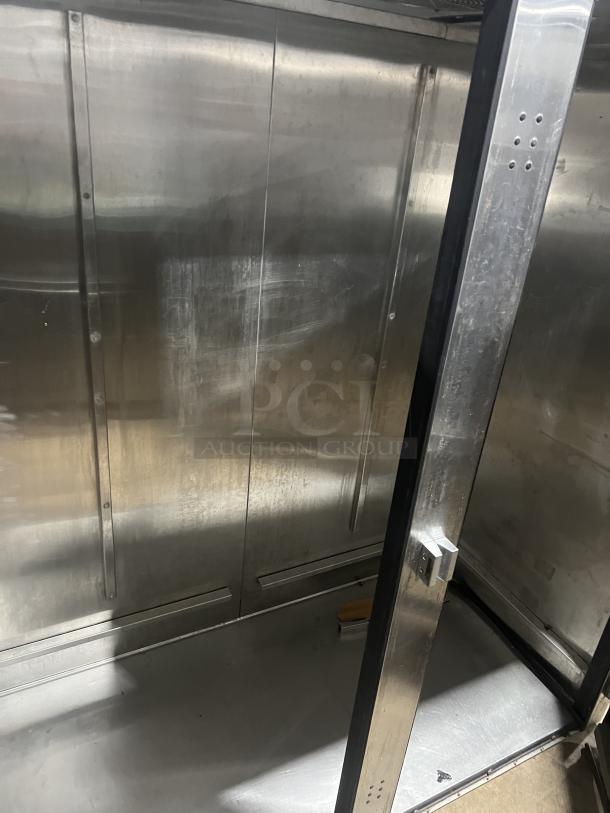 True TR2RRI-2S commercial stainless steel 2-door refrigerator, interior view, showing spacious storage in good condition.