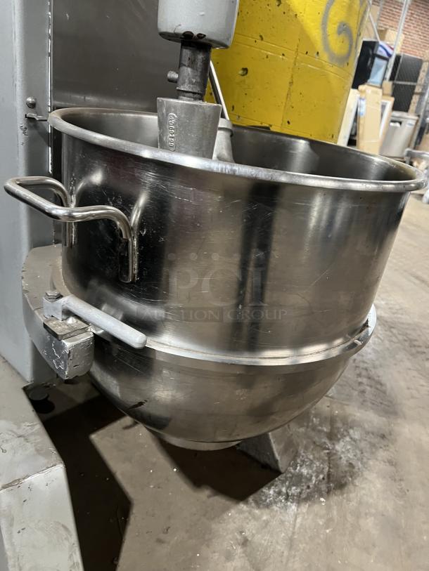 Univex SRM60+ 60 Qt mixer with stainless steel bowl and wire whisk, 208-240V 1 phase, on legs, in working condition.