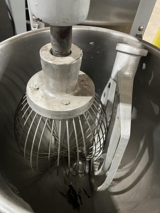 Univex SRM60+ 60 Qt Planetary Mixer with stainless steel bowl and wire whisk attachment, on legs, electric, working condition.