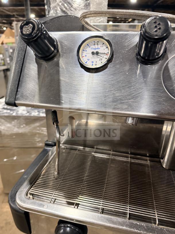 Danesi stainless steel 3-group espresso coffee machine, commercial grade, featuring dial gauge and steam wand, excellent condition.