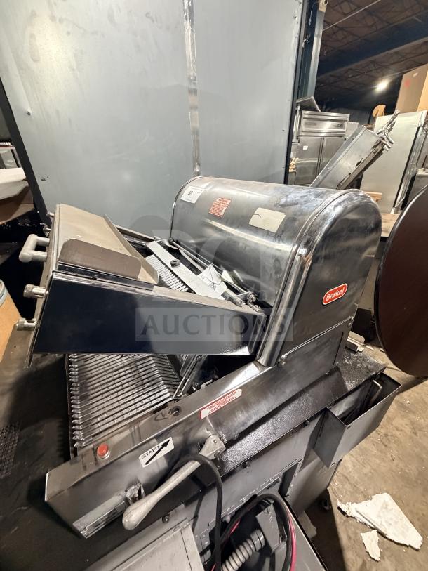 Berkel commercial stainless steel countertop bread slicer in good condition, featuring original branding and operational markings.