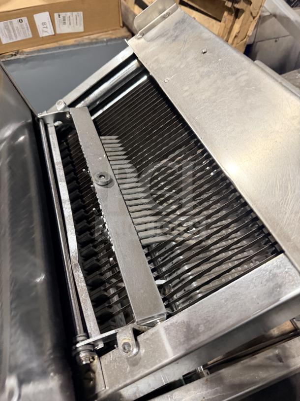 Berkel commercial stainless steel countertop bread slicer with multiple cutting blades. Appears in good condition.