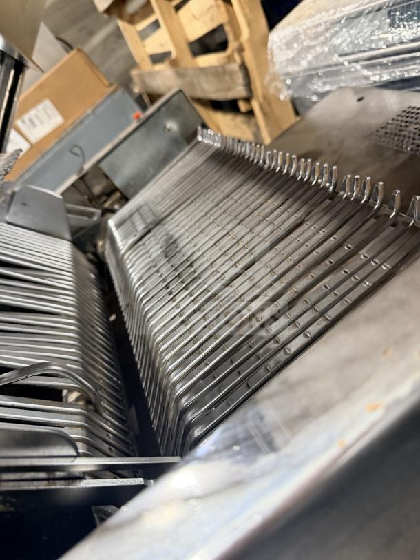 Berkel commercial stainless steel countertop bread slicer, featuring metal blades and sturdy construction, in used condition.