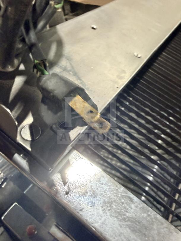 Berkel Commercial Stainless Steel Countertop Bread Slicer in used condition, showing a standard power plug and metallic body.