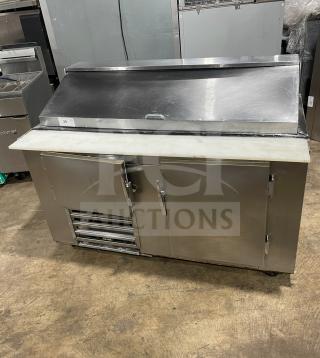 Commercial stainless steel 2-door refrigerated bain marie salad/sandwich prep table with cutting board and poly-coated rack, on casters.