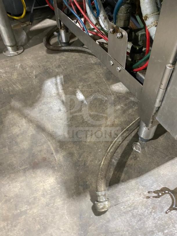 ADS under-counter commercial dishwasher, Model ETAF-M. Stainless steel, 120V 1 Phase. Visible wiring and plumbing.