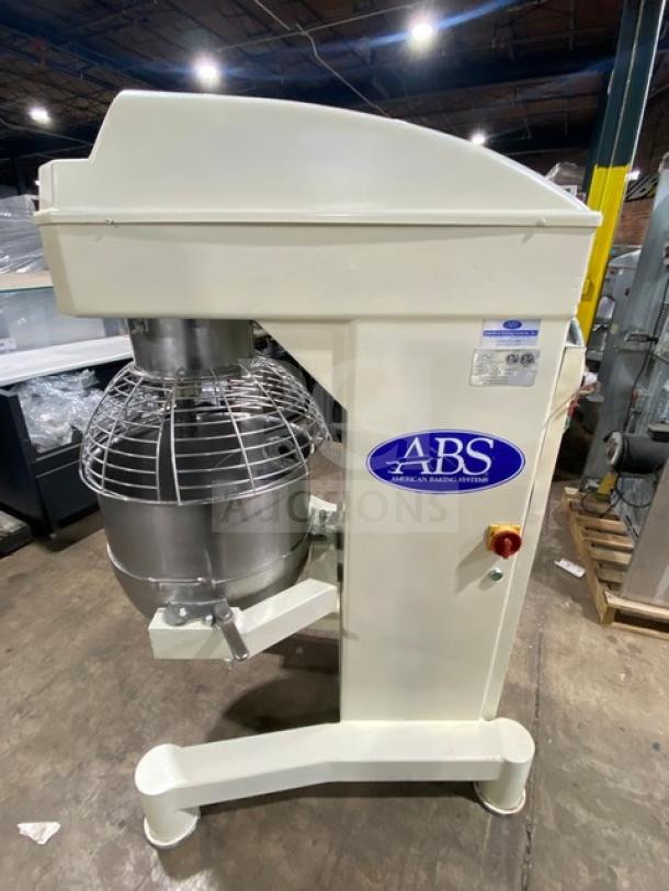 ABS SM80L heavy-duty 80 qt. planetary dough mixer with stainless steel bowl guard, mixing bowl, and flat beater attachment.