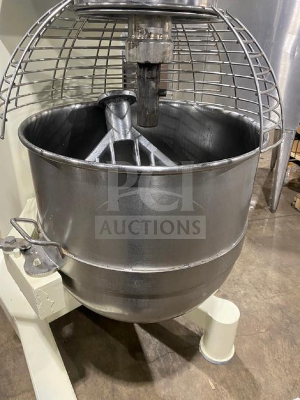 ABS Model SM-80L electric dough mixer, 80 Qt., with stainless steel bowl guard, mixing bowl, and flat beater. 208V 3 Phase.