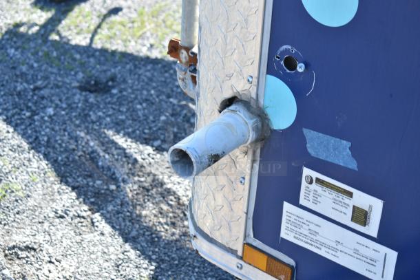 2019 Quality Cargo 8.5' x 24' mobile kitchen trailer, exterior view showing pipe and manufacturer label with VIN 50ZZ1E426KN012862.