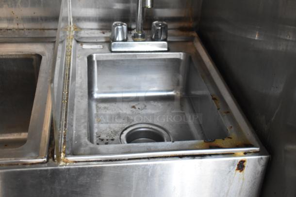 Stainless steel sink in mobile kitchen trailer, visible corrosion and dirt, part of 2019 Quality Cargo 8.5' x 24' unit.
