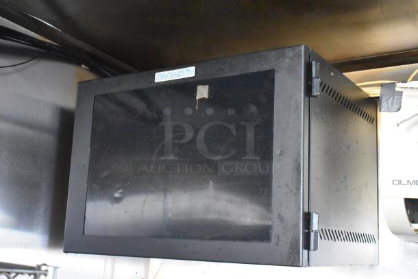 Black Great Lakes storage box mounted inside the 2019 Quality Cargo mobile kitchen trailer, showing edge ventilation.