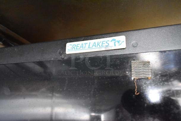 Label on mobile kitchen trailer interior reads "GREAT LAKES" with an outline of the Great Lakes region.