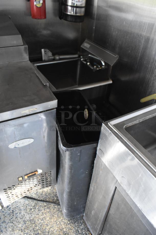 2019 Quality Cargo mobile kitchen trailer interior, featuring stainless steel equipment and refrigeration.