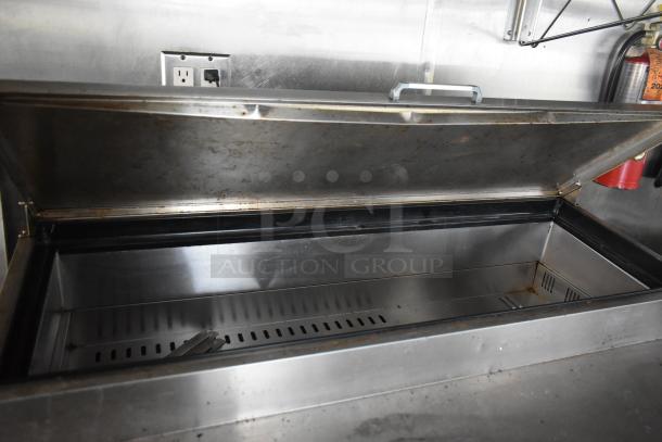 2019 Quality Cargo mobile kitchen trailer, stainless steel interior, includes refrigeration and grease hood system.