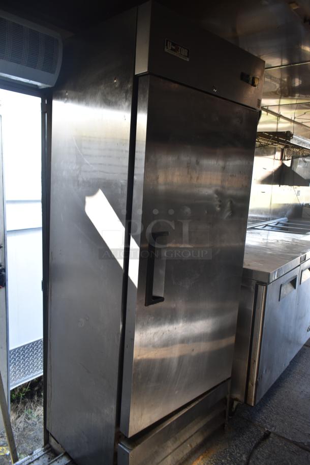 2019 mobile kitchen trailer with stainless steel refrigeration unit. Equipped with grease hood, fryers, and griddle.