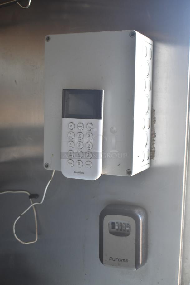 SimpliSafe security panel and Puroma lockbox installed inside 2019 Quality Cargo mobile kitchen trailer, Burger King spec.