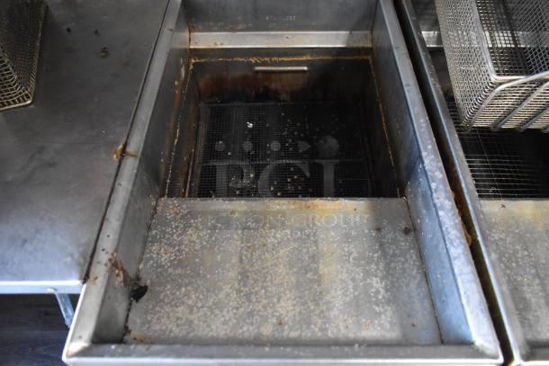 Close-up of fryer inside 2019 Quality Cargo 8.5' x 24' mobile kitchen trailer. Signs of use and wear visible on metal surfaces.
