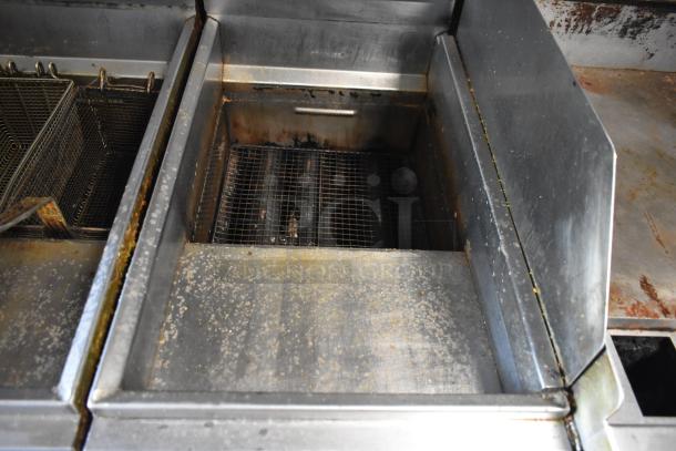 2019 Quality Cargo mobile kitchen trailer with fryer. Shows used fryers with grease buildup.