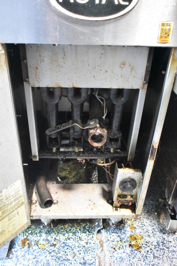 Interior view of 2019 Quality Cargo Burger King mobile kitchen trailer, showing fryer components and grease stains.