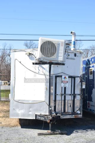 2019 Quality Cargo 8.5' x 24' mobile kitchen trailer, equipped with grease hood and refrigeration. Includes propane and safety signage.