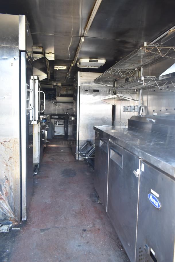 Fully equipped 2019 Quality Cargo 8.5' x 24' mobile kitchen trailer with Burger King specs. Features fryers, griddle, refrigeration, and grease hood.