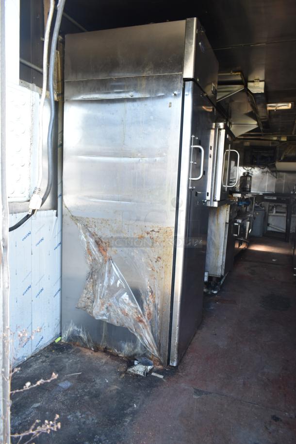 2019 Quality Cargo 8.5' x 24' mobile kitchen trailer, featuring a grease hood, refrigeration, fryers, and griddle. Condition shows visible wear and rust on exterior surfaces.