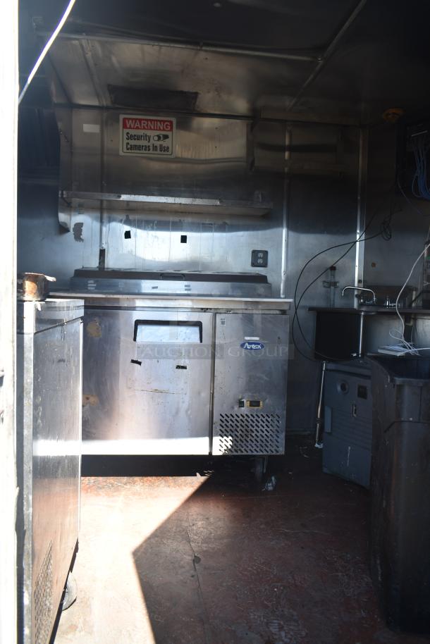 2019 Quality Cargo 8.5' x 24' mobile kitchen trailer with grease hood, refrigeration, fryers, griddle; used condition.