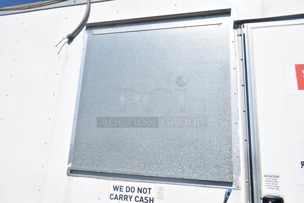 2019 Quality Cargo mobile kitchen trailer, white exterior, signage indicates no cash carried. Features grease hood, refrigeration. VIN 50ZZ1E427KN012840.