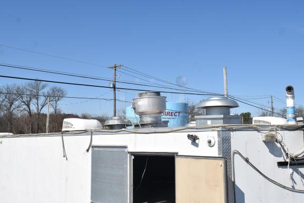 2019 Quality Cargo 8.5' x 24' mobile kitchen trailer with grease hood vents, refrigeration unit, and exhaust system visible. VIN 50ZZ1E427KN012840.