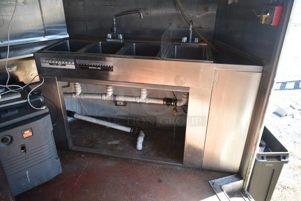2019 Quality Cargo 8.5' x 24' mobile kitchen trailer interior showing a triple-basin stainless steel sink labeled "Water Line."