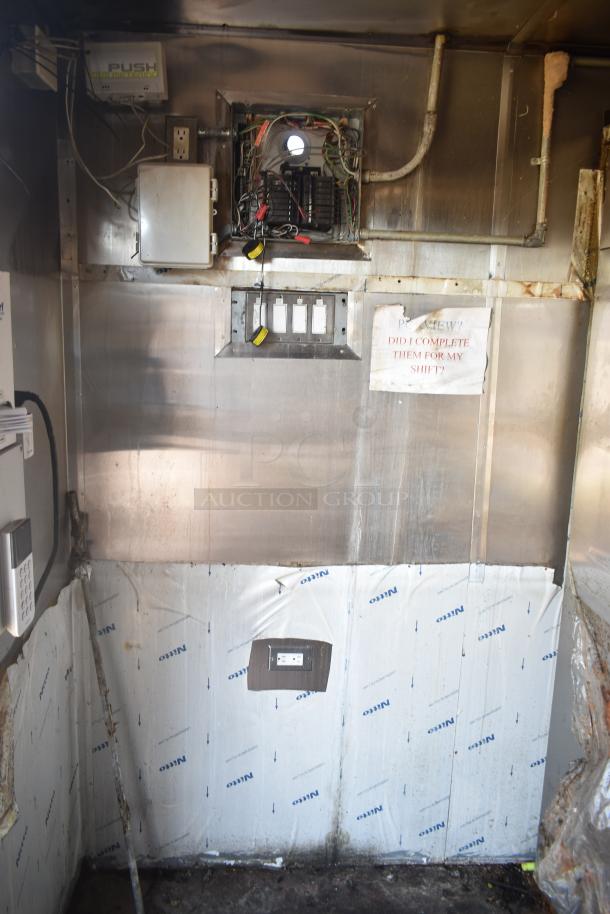 2019 Quality Cargo 8.5' x 24' mobile kitchen trailer interior, showing electrical panel and wiring. Used condition.