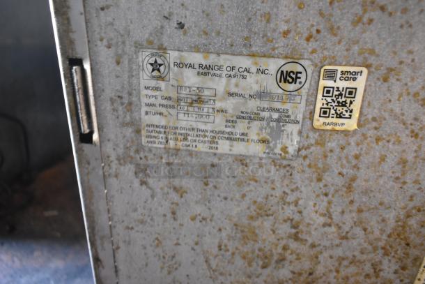 Label on a 2019 Quality Cargo mobile kitchen trailer, indicating Royal Range of Cal. NSF certified gas model RFT-50, 114,000 BTU/hr, serial number partially visible.